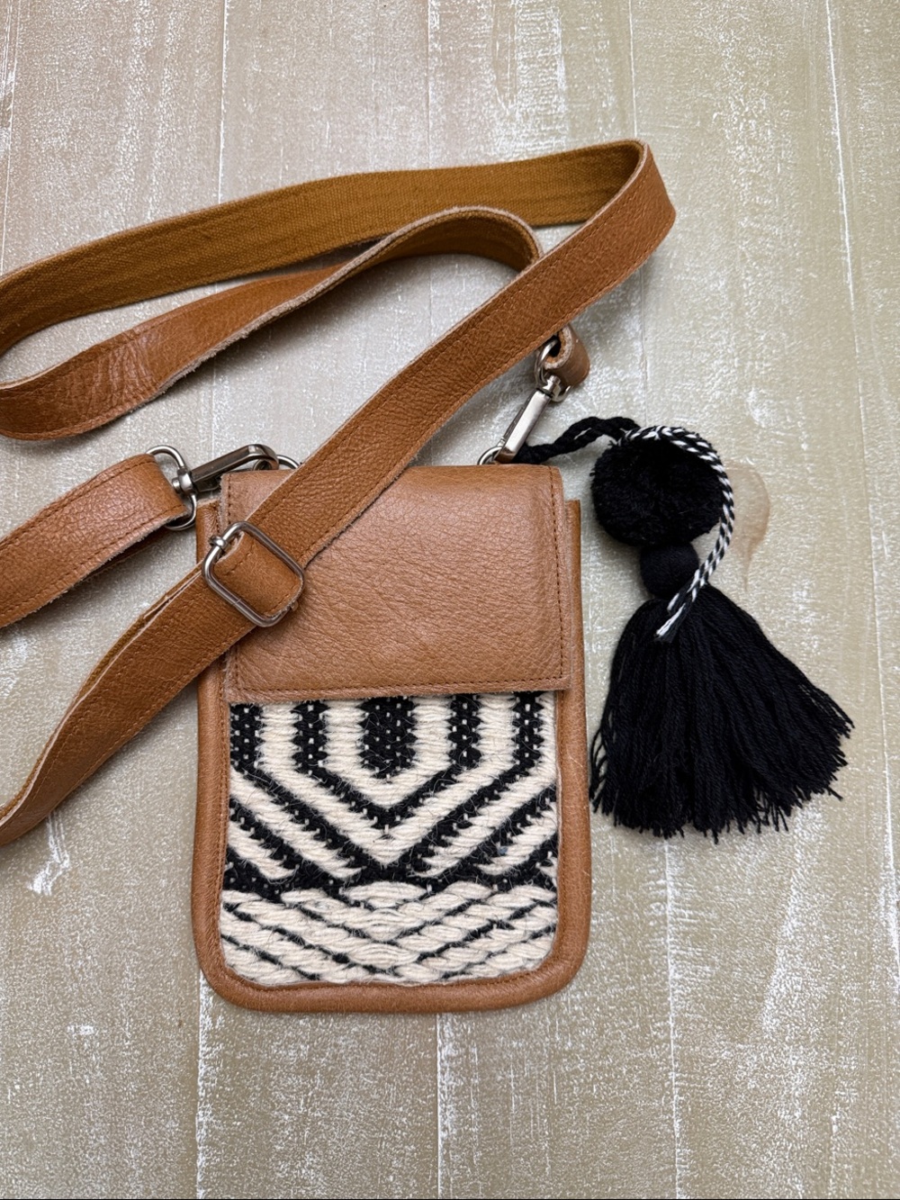 Stanley Street Tan and Black Woven Crossbody Bag with Black Tassel Charm